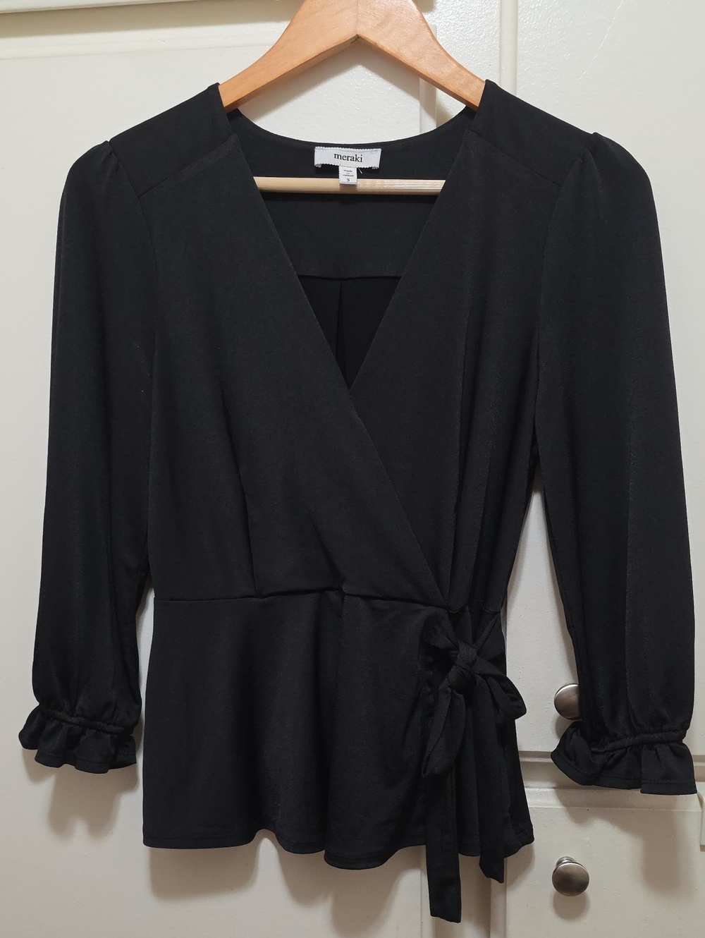 meraki Black Wrap Tie Peplum Top